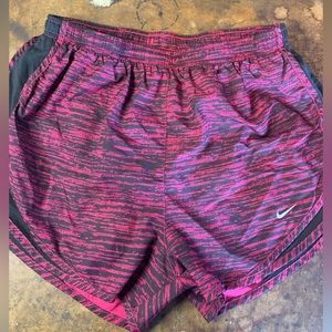 Women’s purple and black medium Nike running shorts
